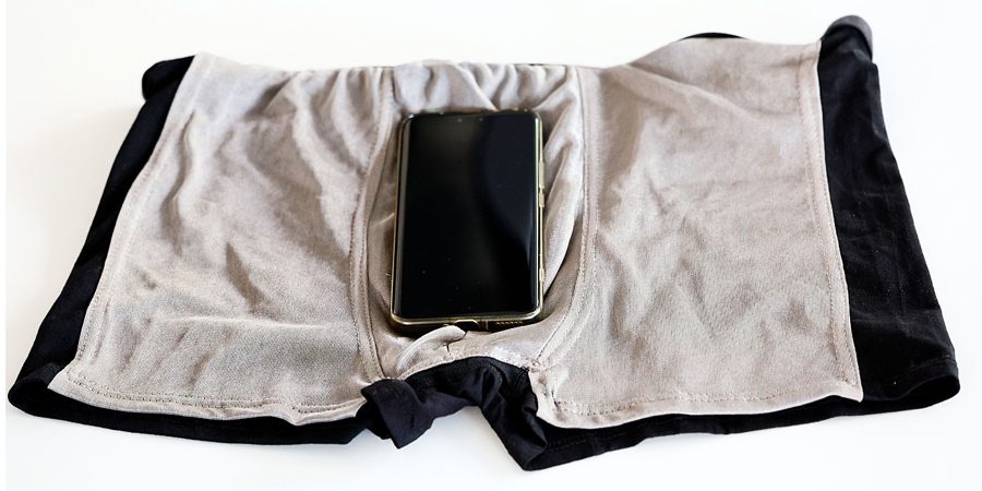 A $1 hat against 5G: testing "radiation protection" by calling a wrapped smartphone
