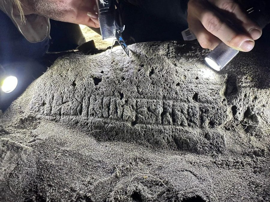 Rune stone with "Here rests" inscription found under medieval chapel floor in Faroe Islands
